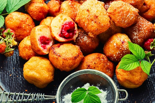 Curd donuts with raspberries