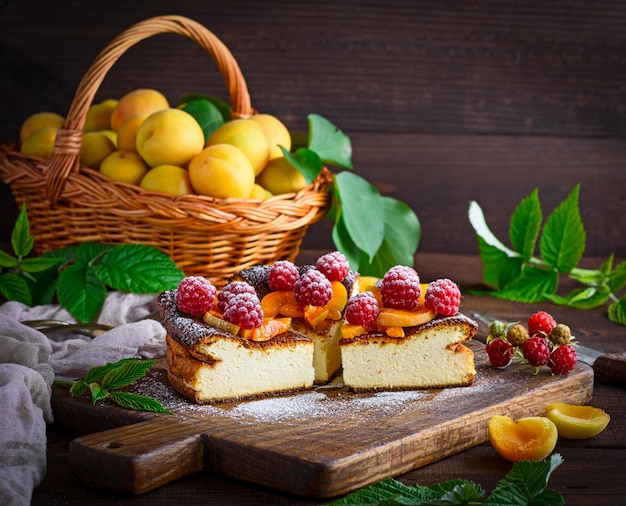 Curd pie with raspberries and apricots