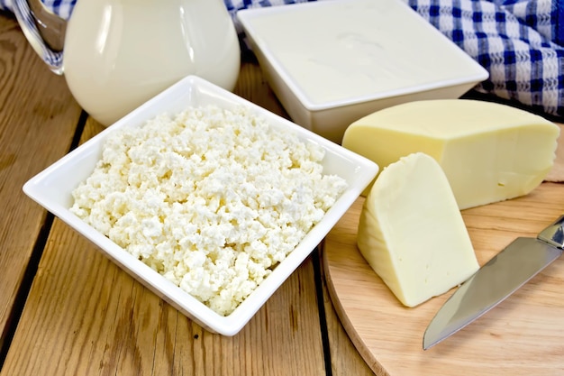 Curd with cheese and napkin on board