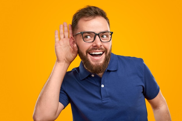 Curious bearded guy listening to rumors