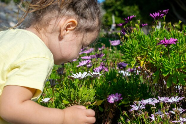 Curious Girl Discovering the beauty of flowers