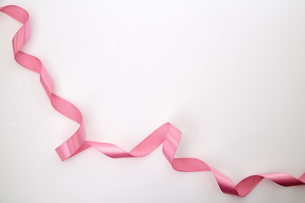 Curled Pink Ribbon On White