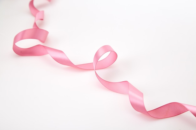 Curled Pink Ribbon On White