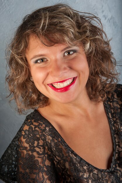 Curly girl in black dress