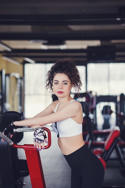 Curly girl relaxing at the gym