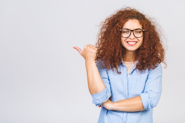 Curly woman posing in studio