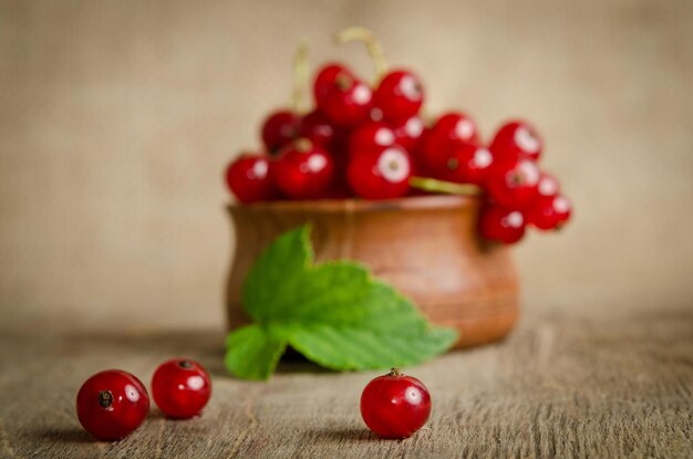 Currant berries on wooden background