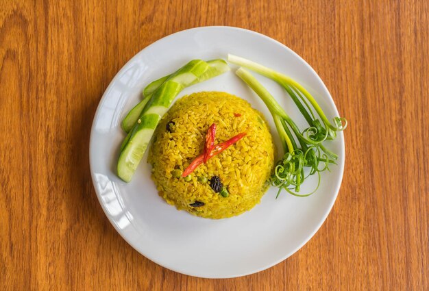 curry fried rice on wood background