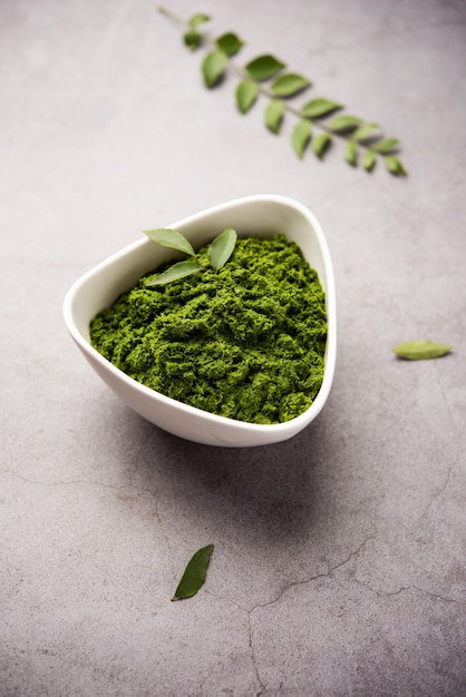 Curry leaves or kadi patta chutney in a bowl