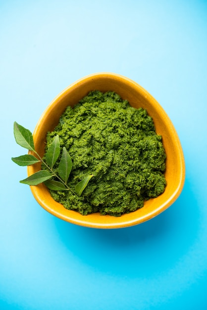 Curry leaves or kadi patta chutney in a bowl