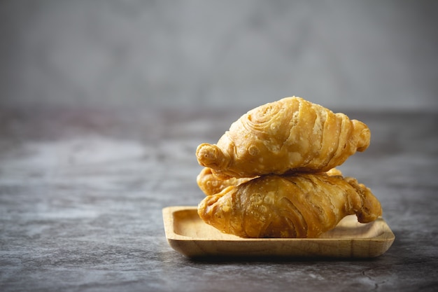 Curry puff pastry on concrete.