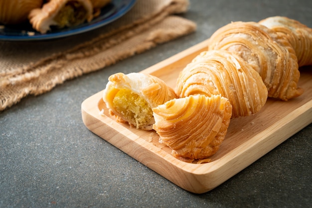 curry puff pastry stuffed beans on wooden plate