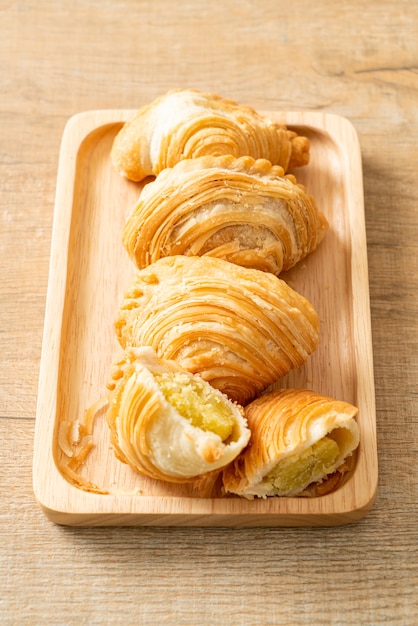 curry puff pastry stuffed beans on wooden plate