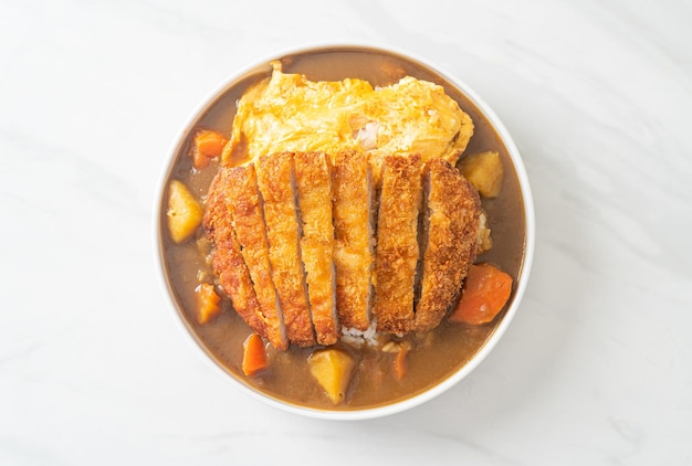 curry rice with tonkatsu fried pork cutlet and creamy omelet - Japanese food style