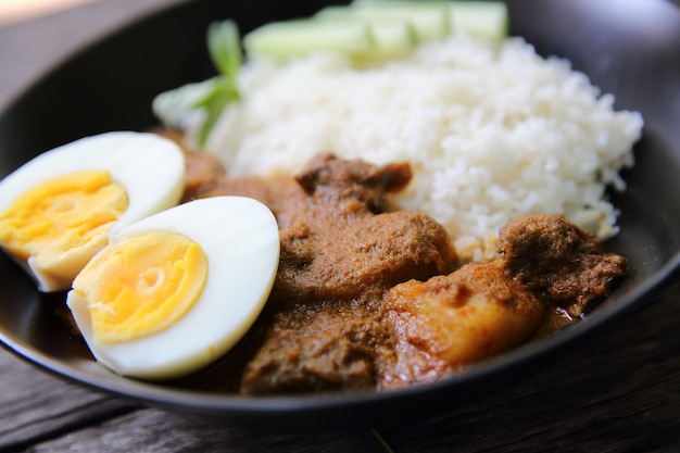 Curry rice on wood background