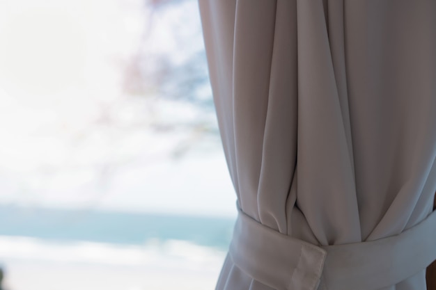 Curtain in hut on the beach at the sea