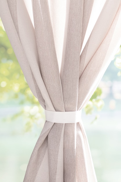 Photo curtains against blurred garden background