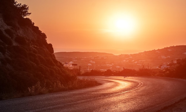 Curved road at beautiful sunset