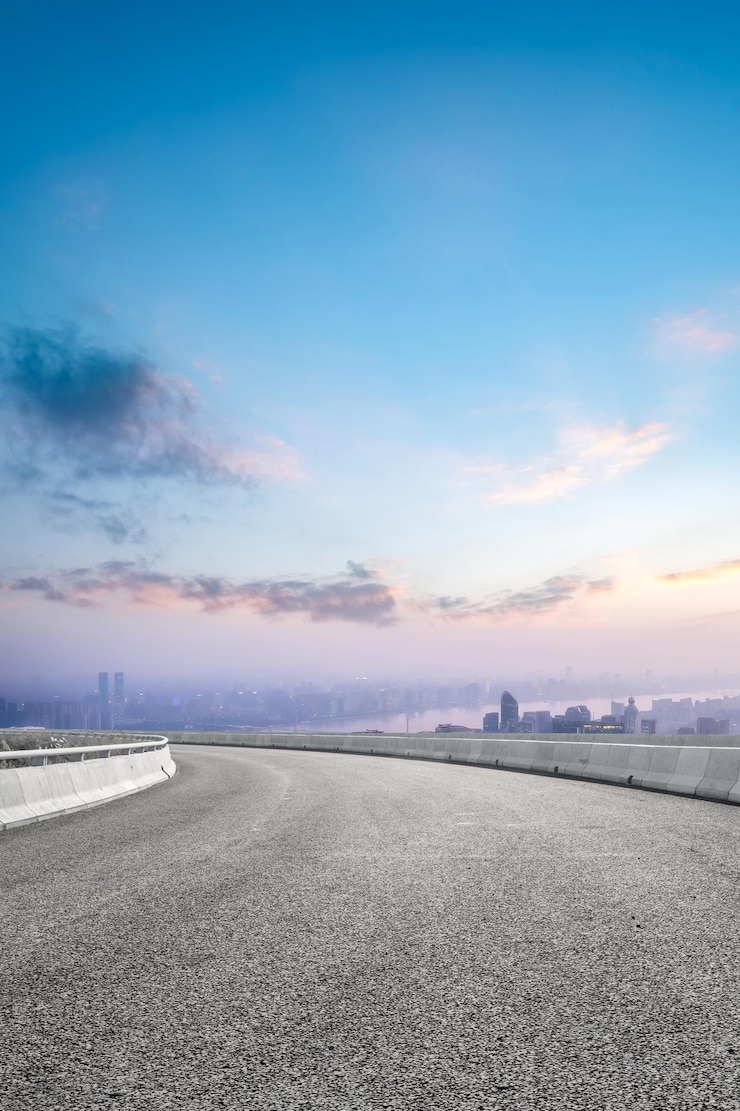 Photo curved urban highway against stunning sunrise