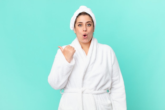 curvy pretty woman after a shower wearing bathrobe