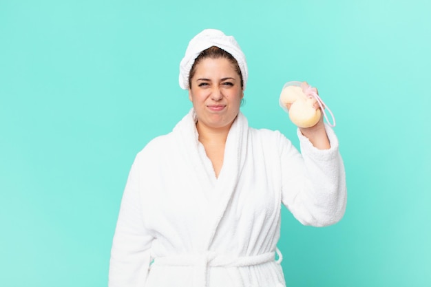 Curvy pretty woman after a shower wearing bathrobe