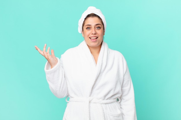 Curvy pretty woman after a shower wearing bathrobe