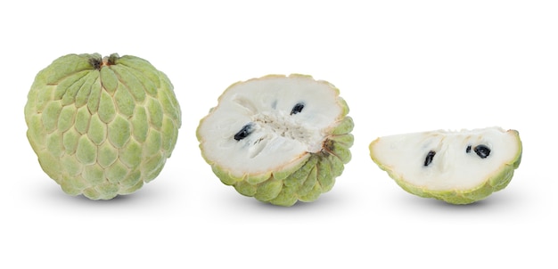 Custard apple fruit on white surface.