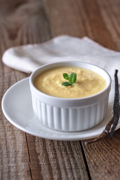 Custard on the wooden surface