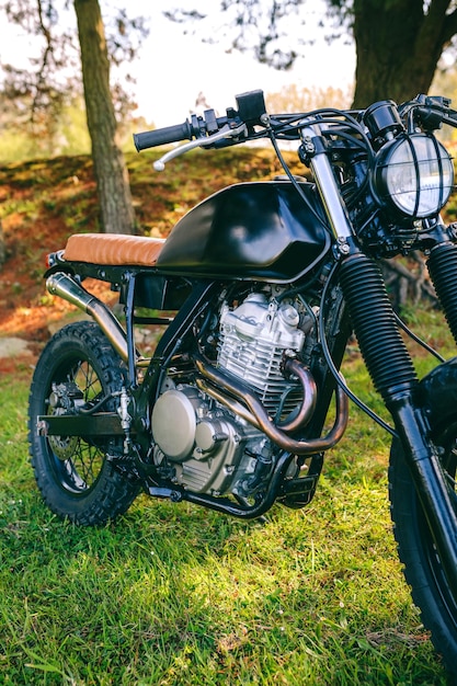 Custom motorcycle parked on the field