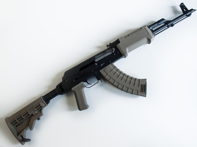 Custom painted AK-47 with a 30 round magazine and a folding stock.