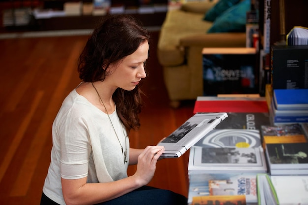 customer books and woman in bookstore library or shop for research learning and relaxing literature reading and person with book browse for education information and studying for hobby or fun