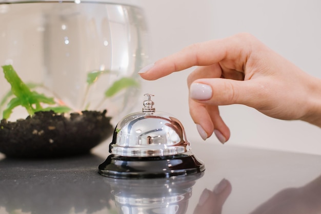 The customer calls a desk call at the hotel reception close\
up