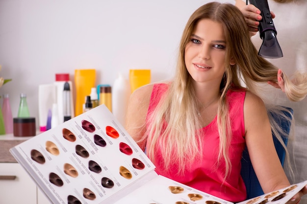 Customer choosing colour for her hair