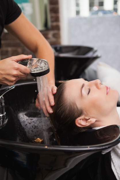 Customer getting their hair washed