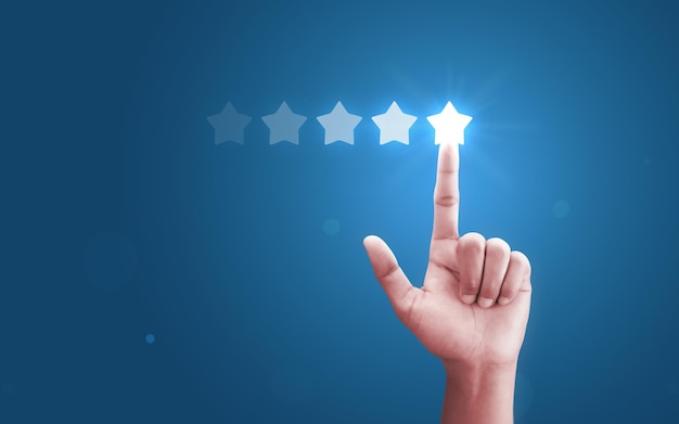 Customer hand review feedback five star rating service or
product quality positive ranking background of best evaluation user
experience success business rate and finger point satisfaction 5
score