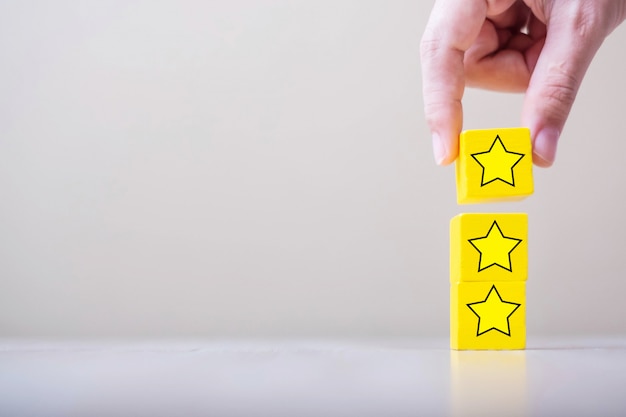 Customer holding wooden blocks with the star symbol
