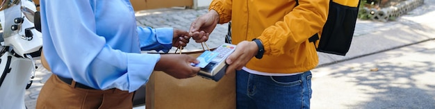 Customer paying for package delivery