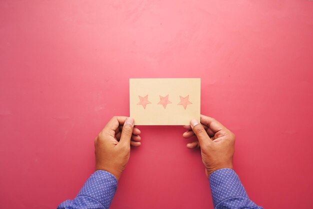 Customer review concept Rating stars on a paper