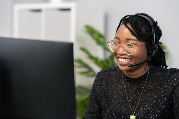 Customer service agent financial advisor call center employee sits at desk in company