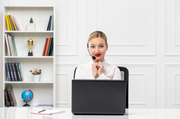 Customer service cute pretty woman in white shirt with headset and computer smiling