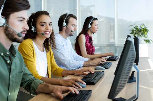 Customer service executives working at office