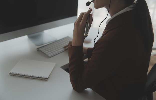 Customer service representative with curly hair talking through headset