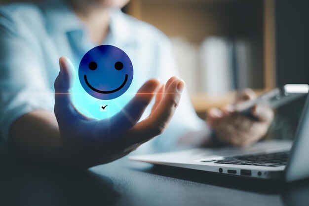 customer service and satisfaction concept business person are touching the virtual screen on happy smiley face icon to give satisfaction in service rating very impressed customer service feedback