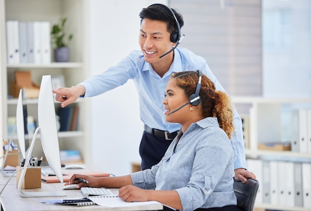 Customer support training and manager with woman on computer for help advice and assistance Telemarketing call center and female intern with Asian man boss for contact crm service and consulting