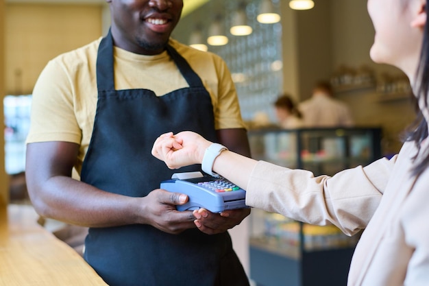 Customer using smartwatch to pay online