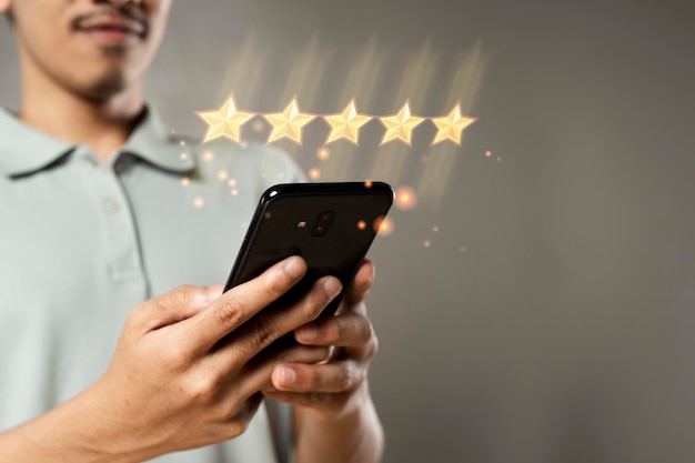 Customer with smartphone show 5 stars virtual screening monitor satisfaction