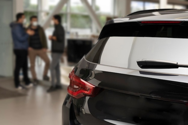 customers at the car dealership, selective focus