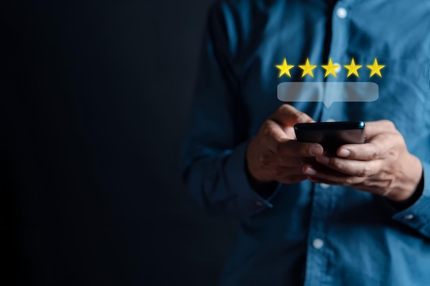 Customers rate service of Businessmen choose to rate 5 stars using smart phone and give five star symbol Excellent rating User give rating feedback good business network score