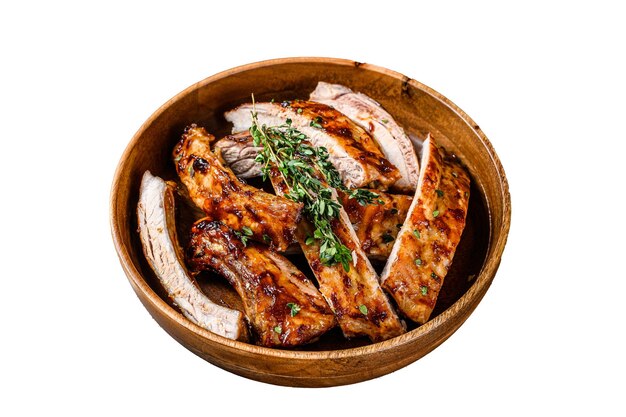 Cut BBQ grilled lamb rack spareribs in a wooden plate Isolated on white background