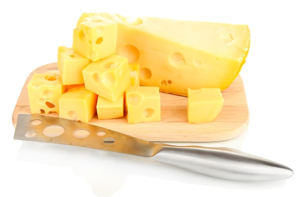 Cut cheese with knife on board isolated on white